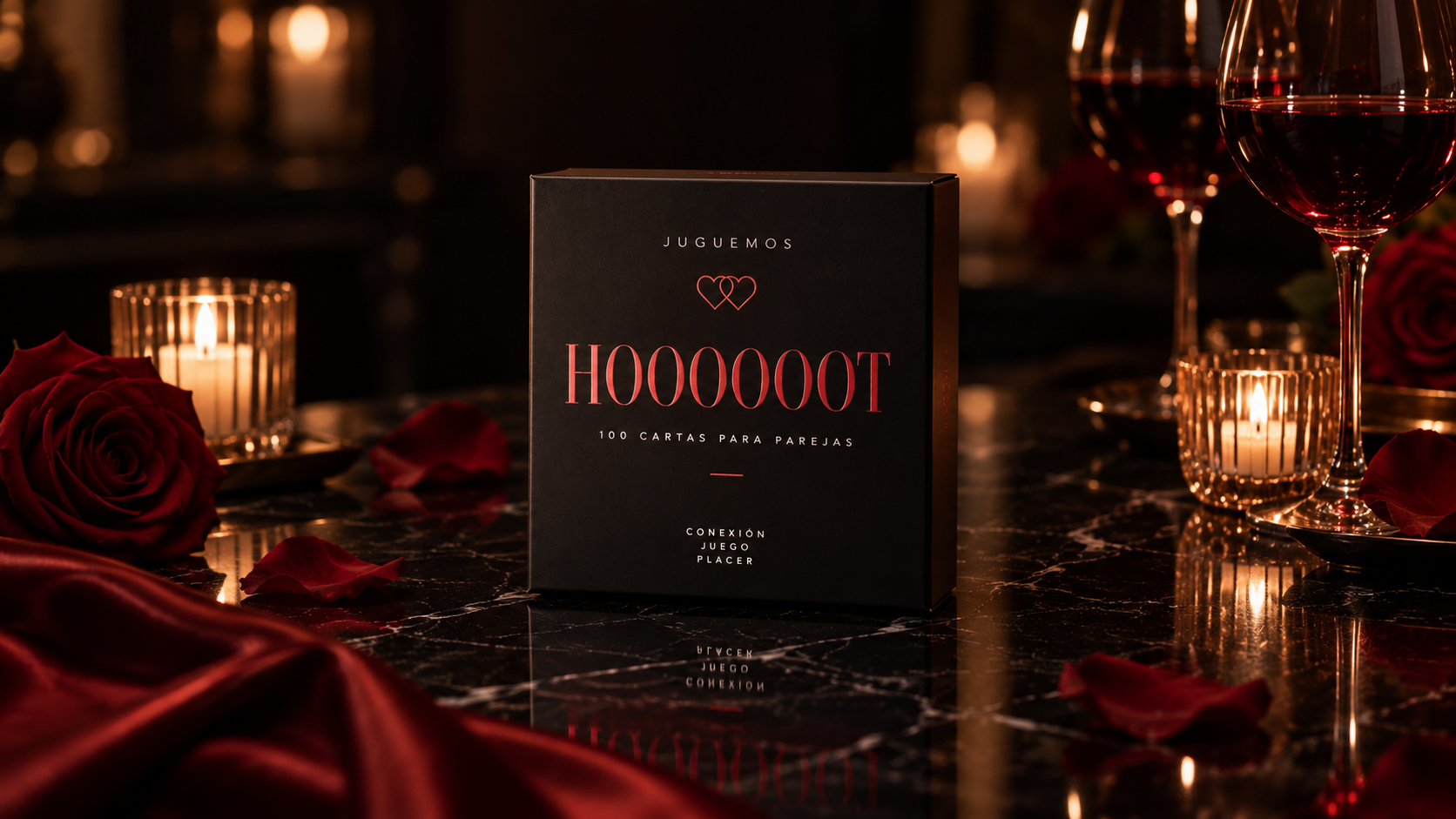 Caja HOOOOOOT en una mesa nocturna con velas y vino